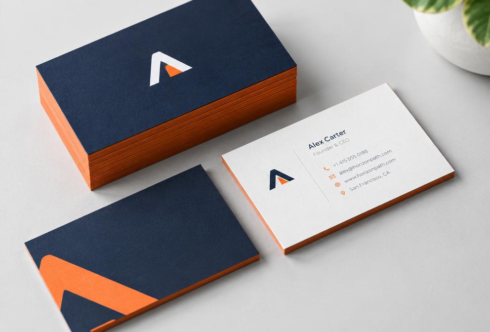 Printed business cards in navy and orange